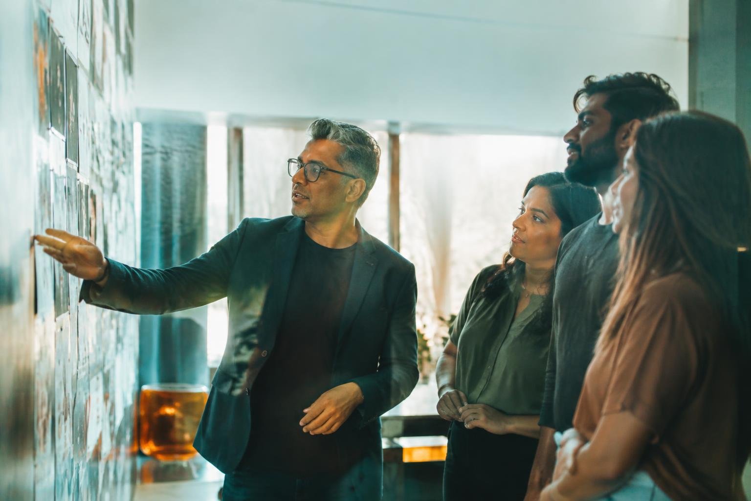 Client and agency team reviewing campaign ideas together