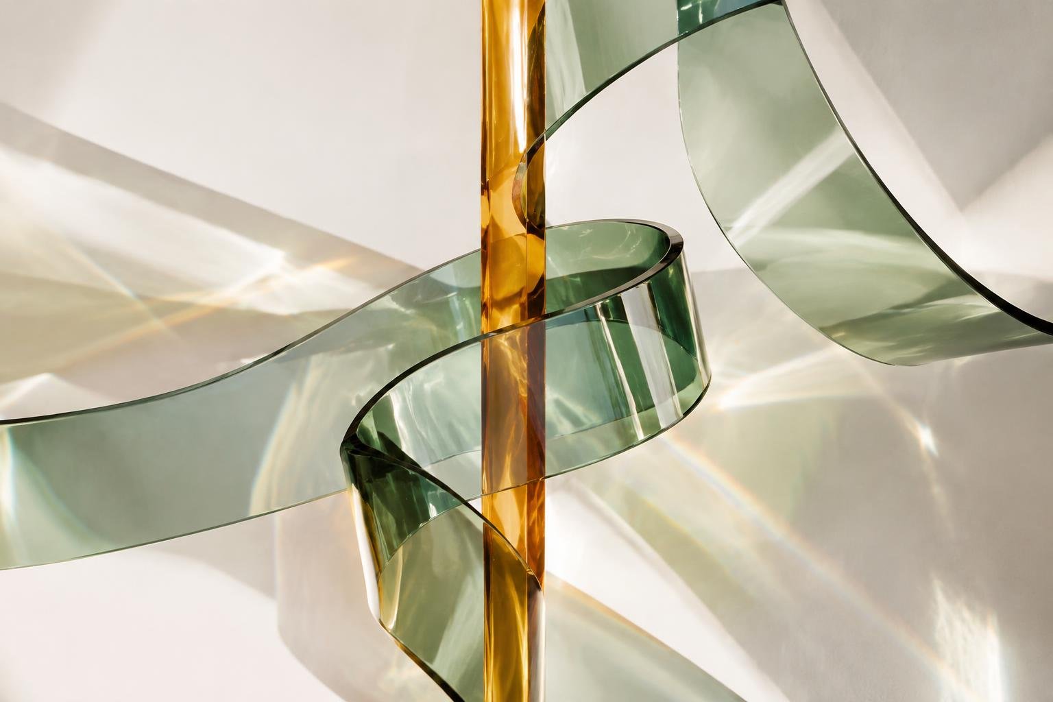 Abstract green and amber glass refracting light